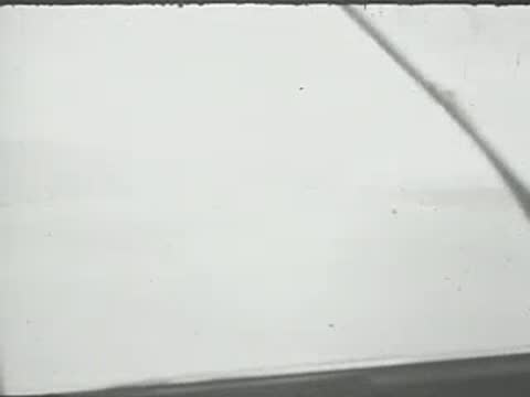 A view from inside an aircraft cockpit looking out the windshield.