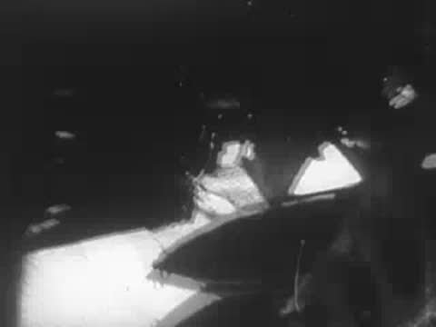 Interior view through an aircraft window or structure with bright light.