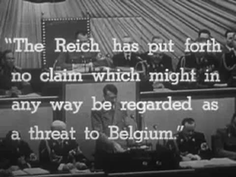 Adolf Hitler at podium with English subtitle text overlay.