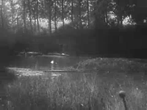 A river surface with smoke and distant silhouettes of soldiers crossing.
