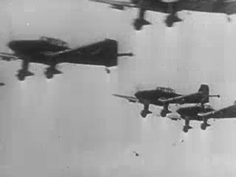 Twin-engine military aircraft flying in formation against a bright sky.