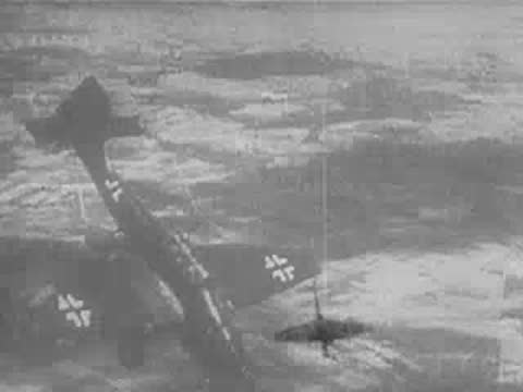 Air raid with anti-aircraft tracers lighting up the night sky over a city, WWII