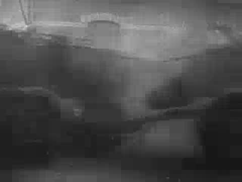 Dark, blurry footage of fortifications or a bunker structure, WWII