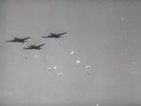 World War II bombers drop parachutes in flight, archive footage