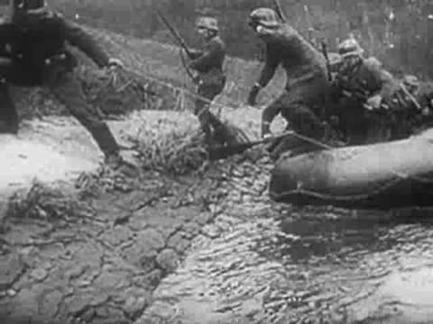 Soldiers pull an inflatable boat from water, archive footage