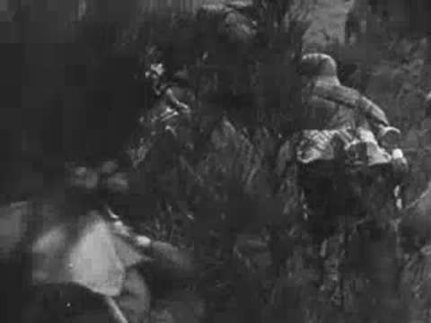Soldiers navigate smoke and terrain obstacles, archive footage