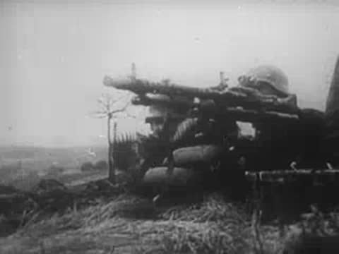 German soldiers advance and a heavy anti-aircraft gun, archive footage