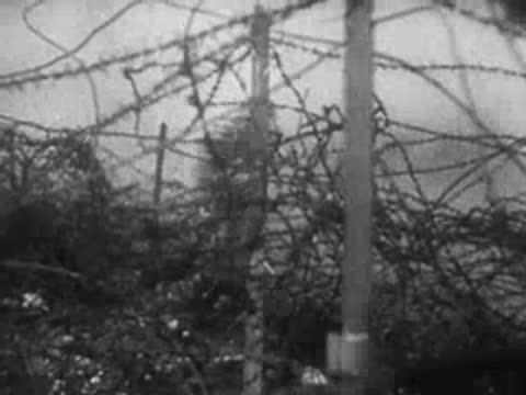 Soldier cuts through barbed wire in combat, archive footage