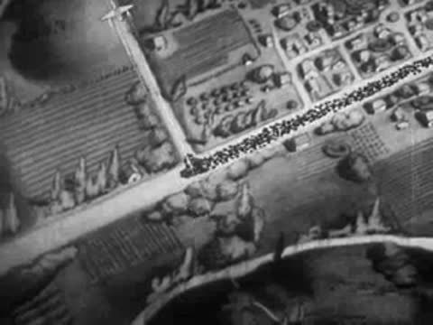 Aerial animation of large transport planes flying over a mapped landscape.