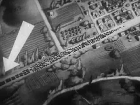 Aerial animation showing troop movements on a map with an arrow marker.