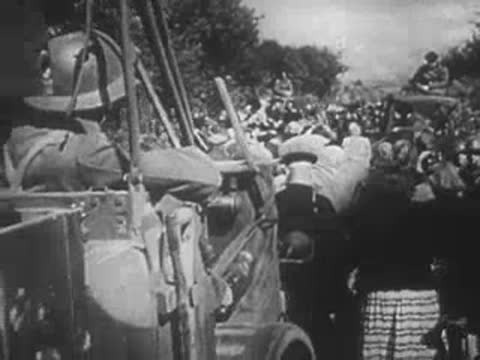 military trucks and crowded civilians on a road in wartime