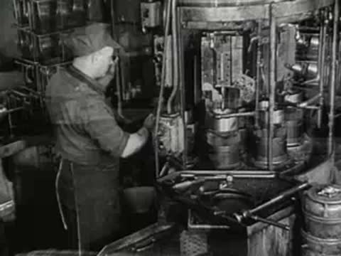 Transition from a kitchen scene to a factory worker at a machine.