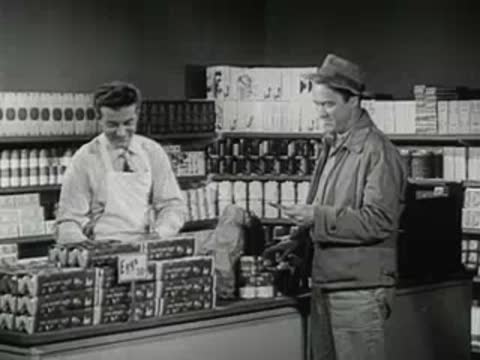 Hands placing eggs into cartons, a grocery store clerk and customer, and candling lights