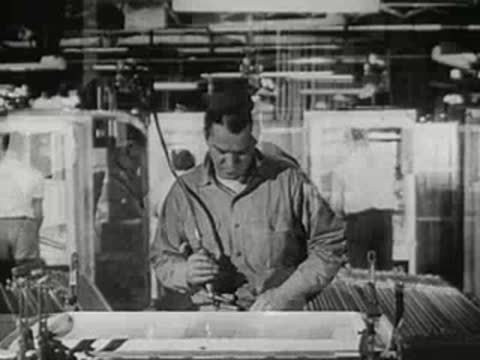 A man eating at a table, a worker in a factory, and a store clerk and customer