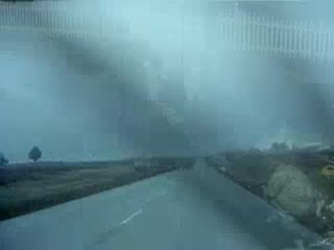 driving on wet road in rain, overcast weather