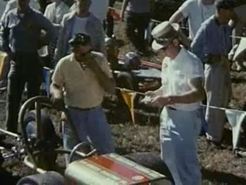 mechanic working on race car part, close-up details