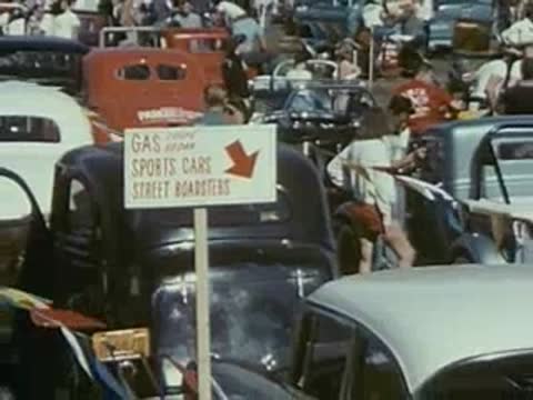 crowd and cars at vintage car show, 1950s event