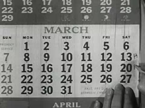 March 1949 wall calendar, hand turns page to April
