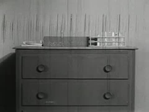Dresser with chemistry set box on top in bedroom