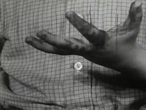 Close-up of boy's fingers stained with dark liquid