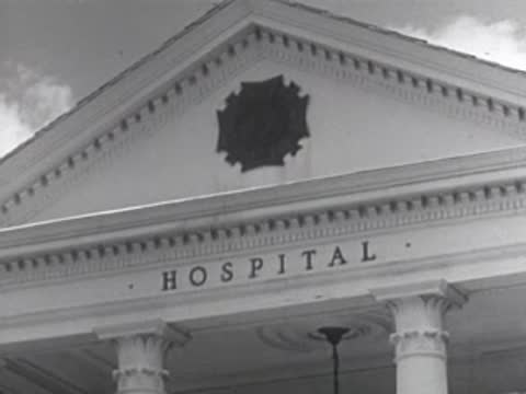 The exterior facade of a community hospital building with large white columns.