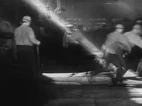 Montage of industrial production workers entering facility and domestic scenes