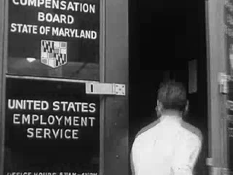Entrance of the United States Employment Service office with a person entering