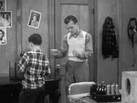 man and boy in room experimenting with liquid in tank