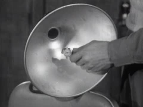 Close-up of metal parabolic reflector bowl, vintage educational film equipment