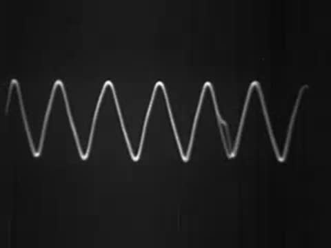 Oscilloscope screen displaying sound wave frequency changes in real time