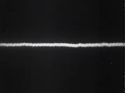 oscilloscope screen displaying sound waves fading to a flat line