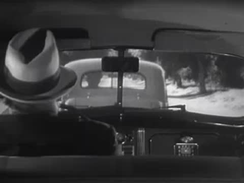 Driver's view from inside a car following another vehicle.