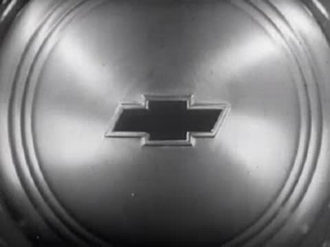 Close-up of Chevrolet hubcap transitioning to "The End" title.