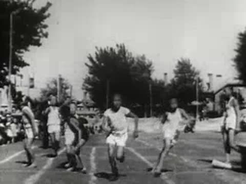 children running a race on an outdoor track during a sports event