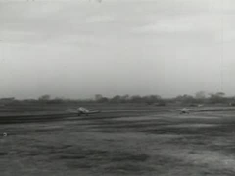 Small airplanes taking off and taxiing on a grassy airfield, modern aviation