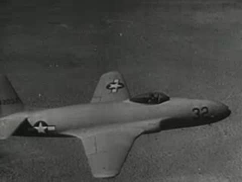 Military jet fighter flying in the sky, mid-20th century archival film.