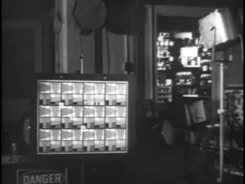 Test pattern grid displayed on equipment in an electronics lab.
