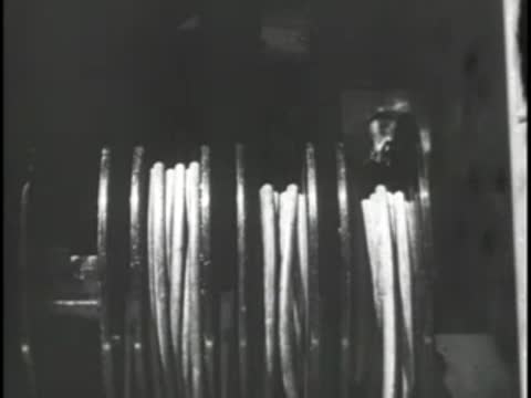 Interior of a mobile unit showing large coils of heavy cables.