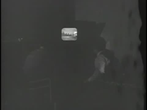 Television monitor displaying broadcast footage of racehorses on the track
