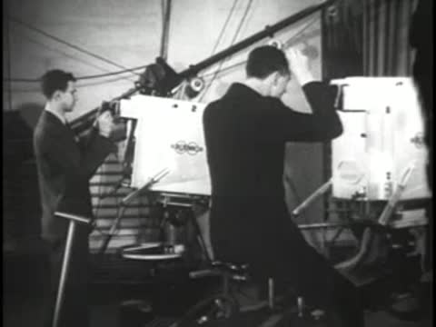 Cameraman operating a large television studio camera during a broadcast