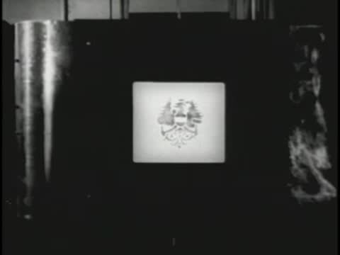 Title cards showing selections from Die Fledermaus by Johann Strauss