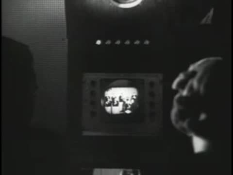 Studio control room monitor displaying a live television broadcast feed.