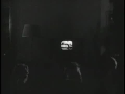 Control room monitor switching to a close-up shot of the orchestra.