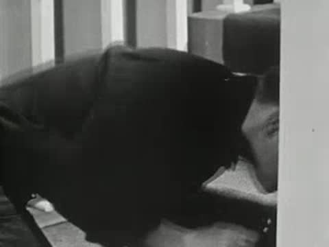 Teenager rushing down the stairs to answer the telephone ringing loudly.