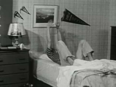 The teenager kicks off the covers and excitedly jumps out of bed.