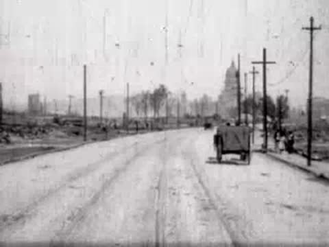 Curved road leading toward a distant domed structure and open landscape.