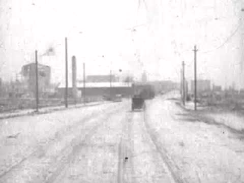 Looking forward from a moving tram down a San Francisco street, historical footage.