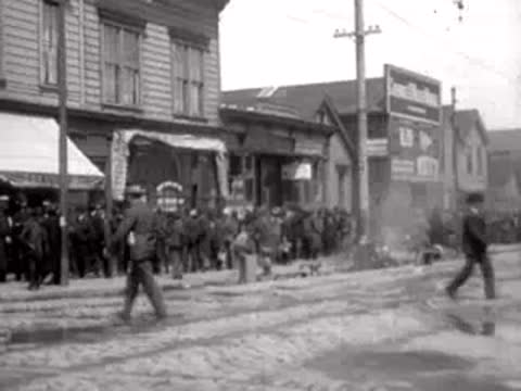 People walking along a San Francisco street in 1906.