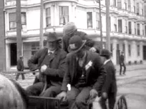men in horse-drawn carriage on San Francisco street, historical footage