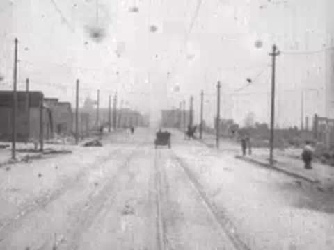 distant carriage driving along damaged road, historical footage